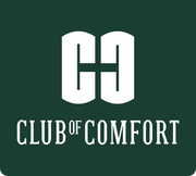 Das Bild zeigt das Logo des "Club of Comfort" mit einem großen, weißen, stilisierten Buchstaben "C" und "H" auf grünem Hintergrund, darunter der Schriftzug "CLUB OF COMFORT" in weißen, leicht schräg gestellten Buchstaben.